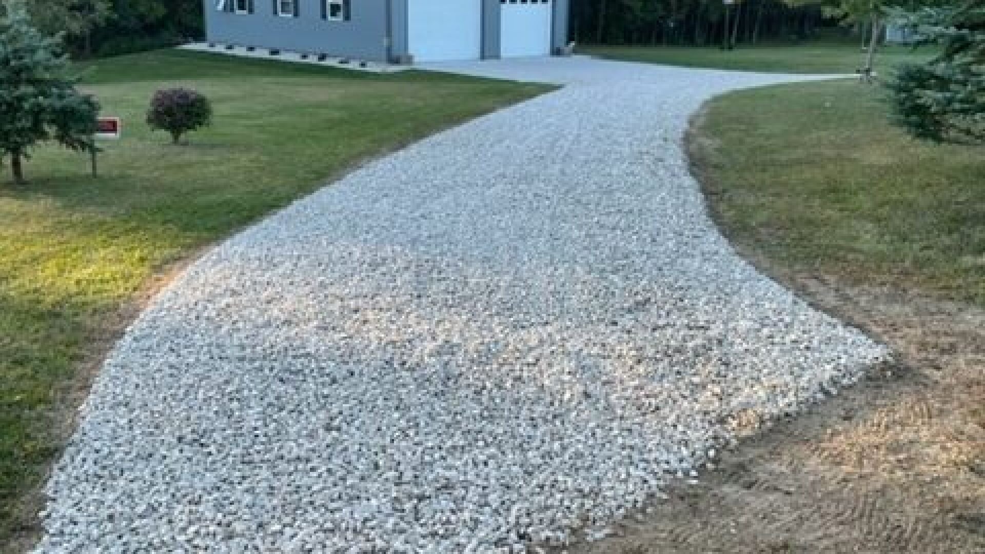 Finished curved white-gravel driveway leading to home in Mason, MI
